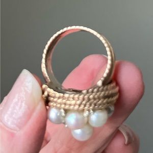 Pearl, diamond, and braided gold ring.